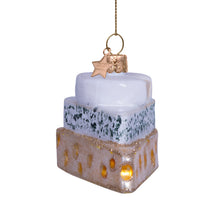 Load image into Gallery viewer, Decorative glass ornament resembling a stack of cheeses with a star on top, hanging against a white background.