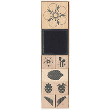 Load image into Gallery viewer, Set of wooden stamps with various flower designs on a white background