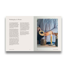 Load image into Gallery viewer, Open book with text and a photo of a person pouring tea.