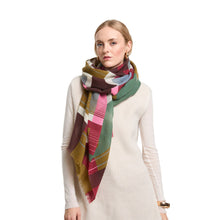 Load image into Gallery viewer, Woman wearing a colorful plaid scarf on a white background