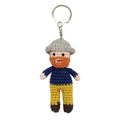 Small handmade crochet keyring depicting  Vincent Van Gogh, with a grey hat and blue jacket with yellow trousers. 