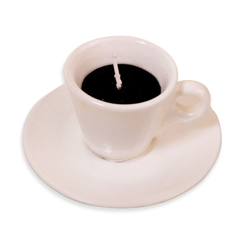Candle shaped like a white ceramic cup and saucer on a white background