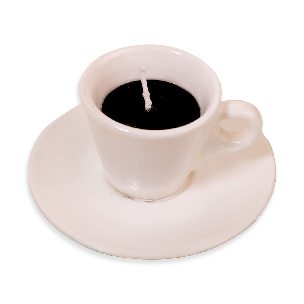 Candle shaped like a white ceramic cup and saucer on a white background
