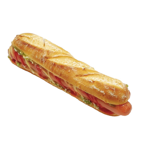Candle shaped as a long sandwich with bread, tomatoes, and green herbs on a white background