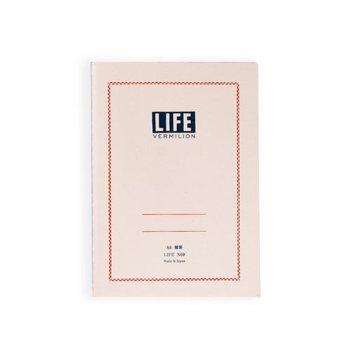 Minimalist A6 notebook with a cream-colored cover, featuring a red decorative border, bold ‘LIFE Vermilion’ title at the top, and space for labeling on the front