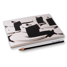 Load image into Gallery viewer, Notebook with black abstract design and a pencil on a white background
