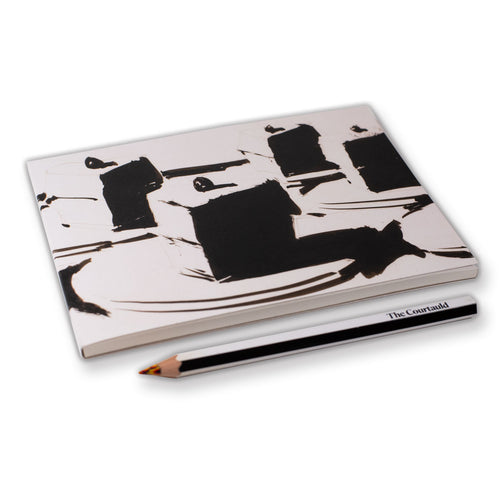 Notebook with black abstract design and a pencil on a white background