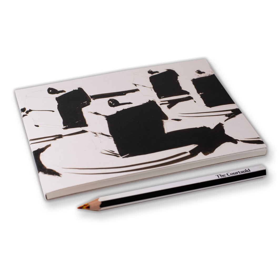 Notebook with black abstract design and a pencil on a white background