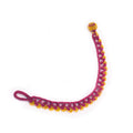 Bracelet with pink and yellow beads on a white background