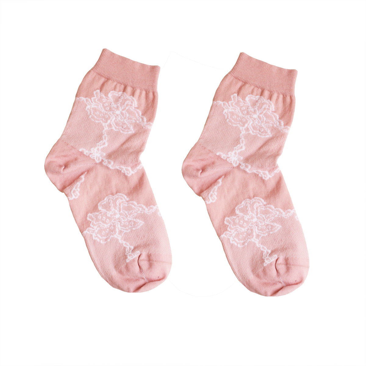 A pair of light pink lace socks with a floral pattern, displayed against a white background.
