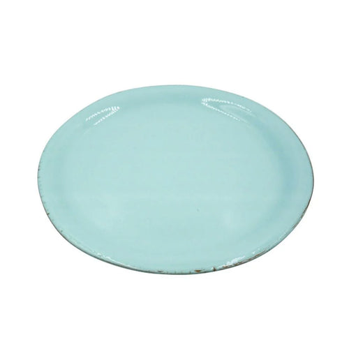 Light blue ceramic plate on a white background