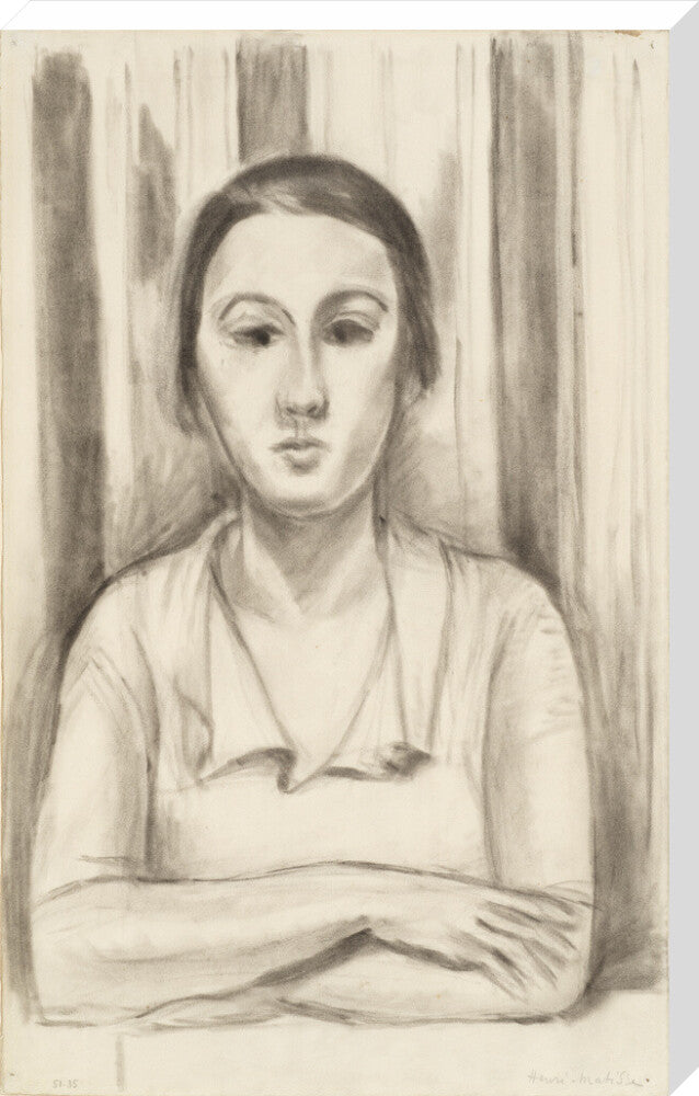 A Woman with her arms on a table