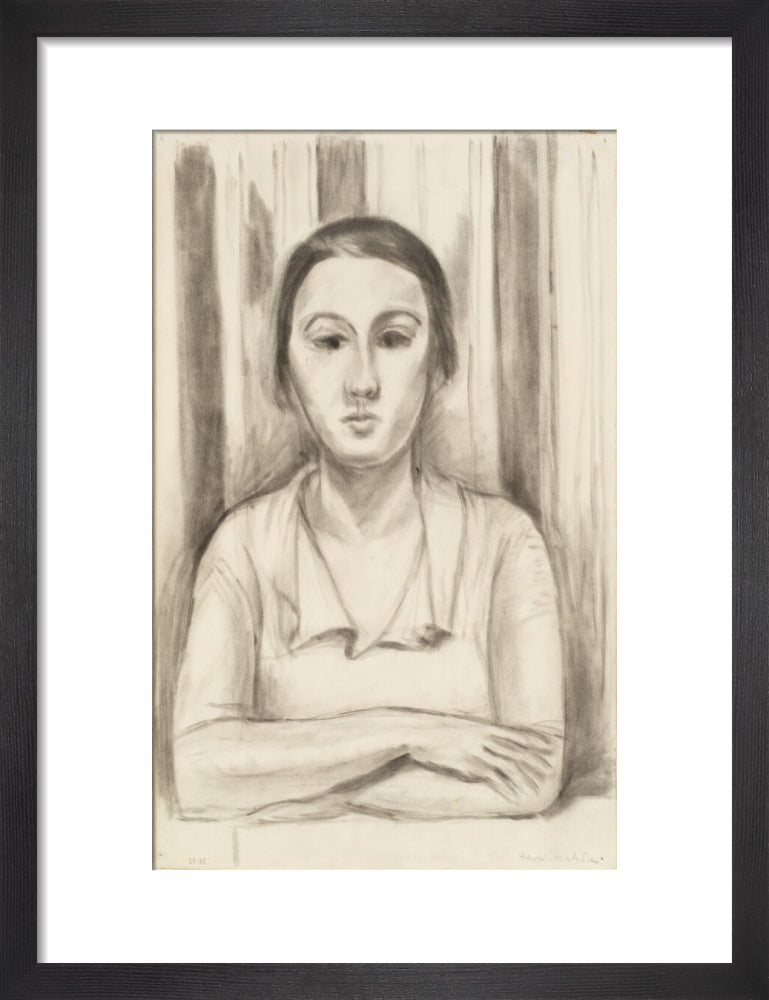 A Woman with her arms on a table
