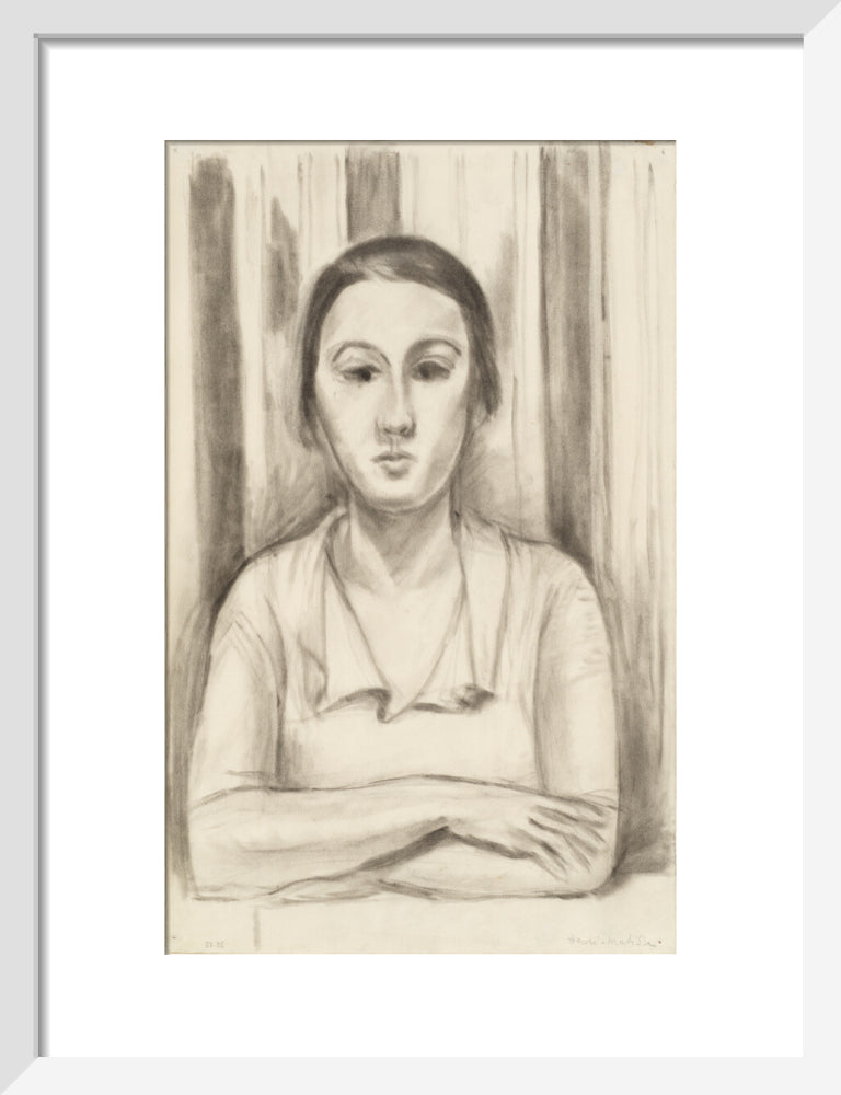 A Woman with her arms on a table