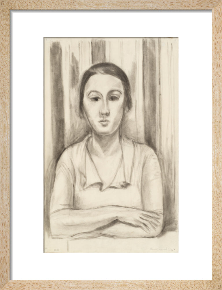 A Woman with her arms on a table