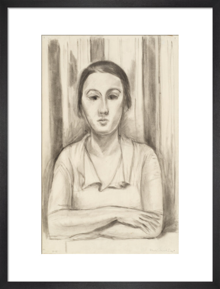 A Woman with her arms on a table