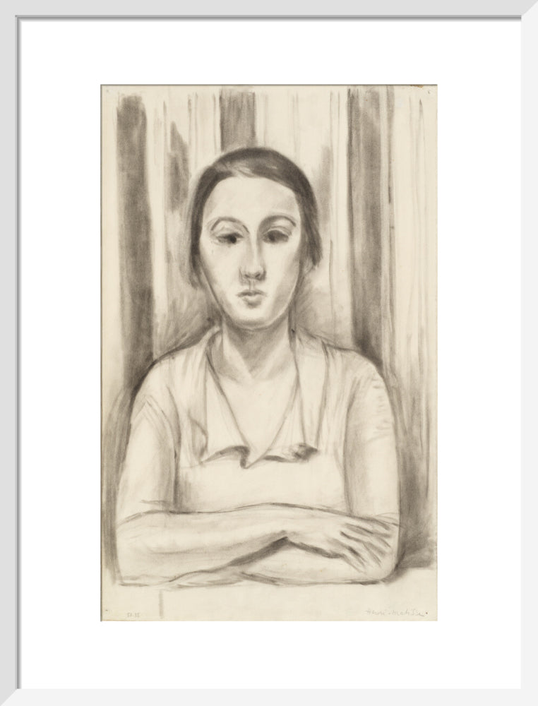 A Woman with her arms on a table