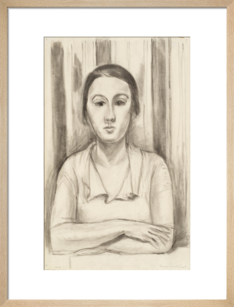 A Woman with her arms on a table