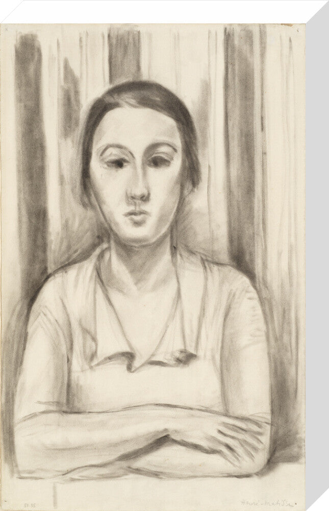 A Woman with her arms on a table