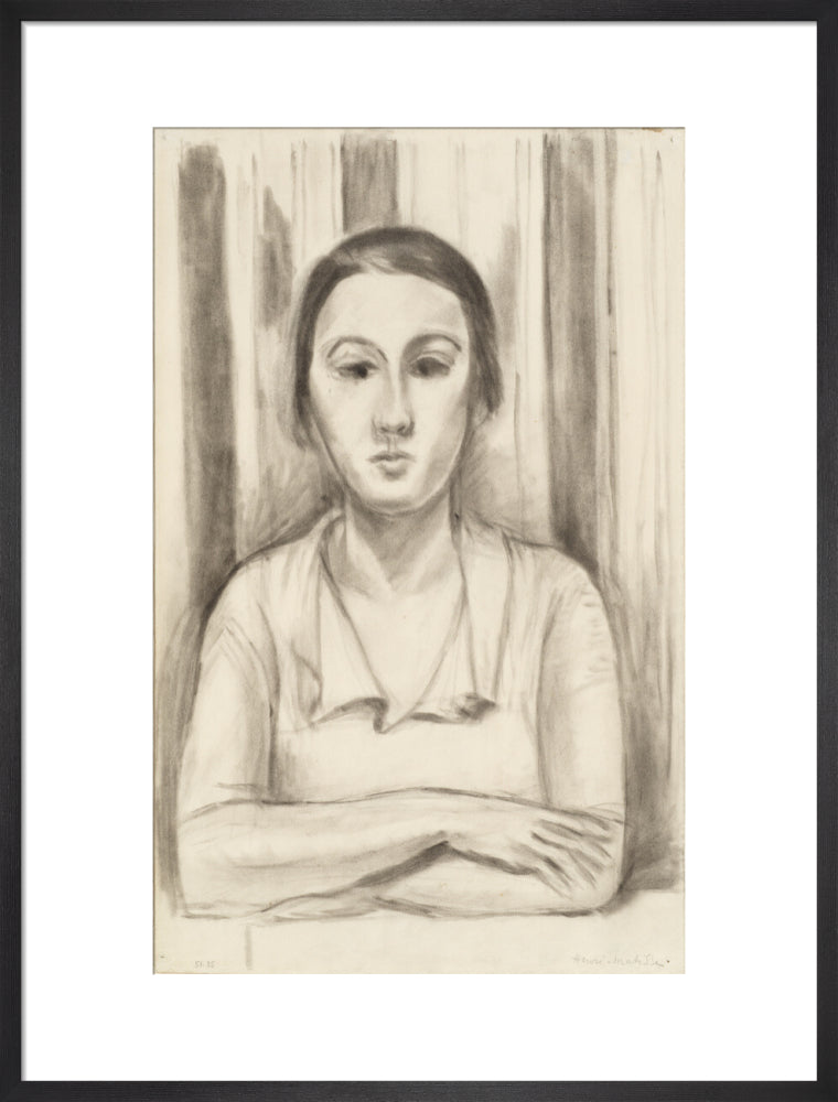 A Woman with her arms on a table