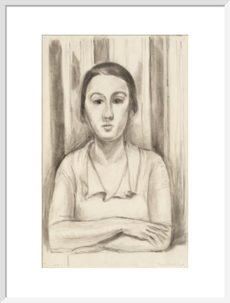 A Woman with her arms on a table