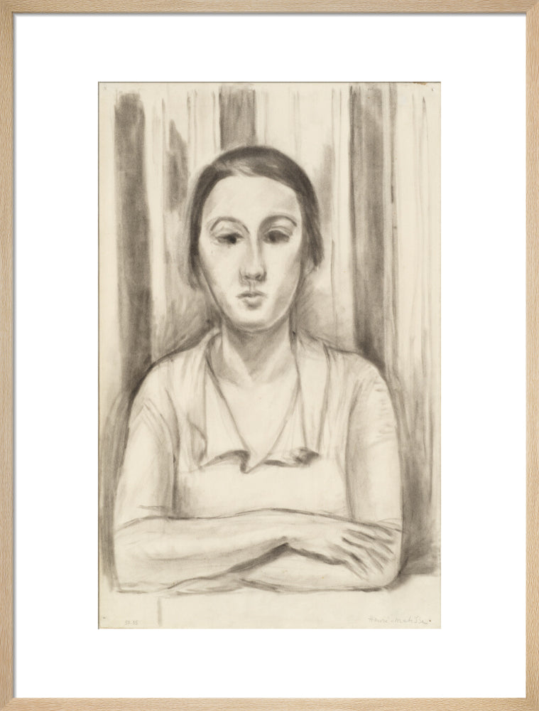 A Woman with her arms on a table