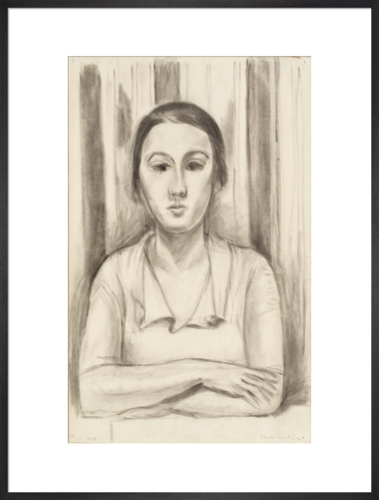 A Woman with her arms on a table