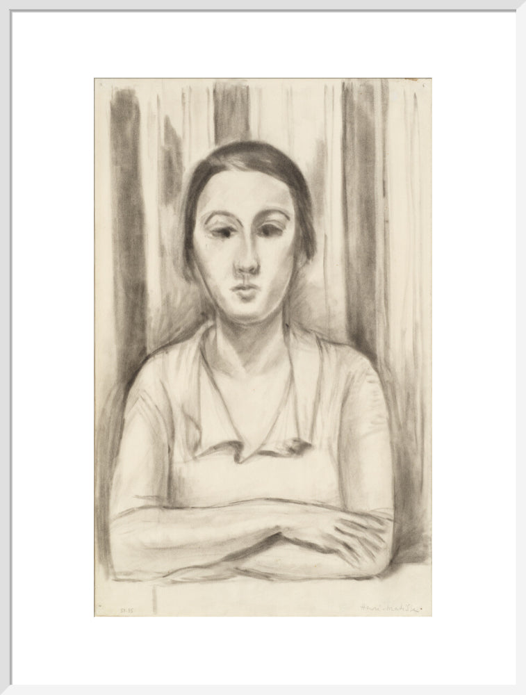 A Woman with her arms on a table