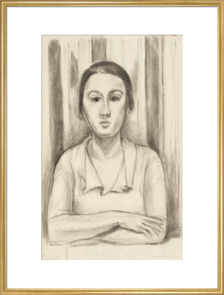 A Woman with her arms on a table