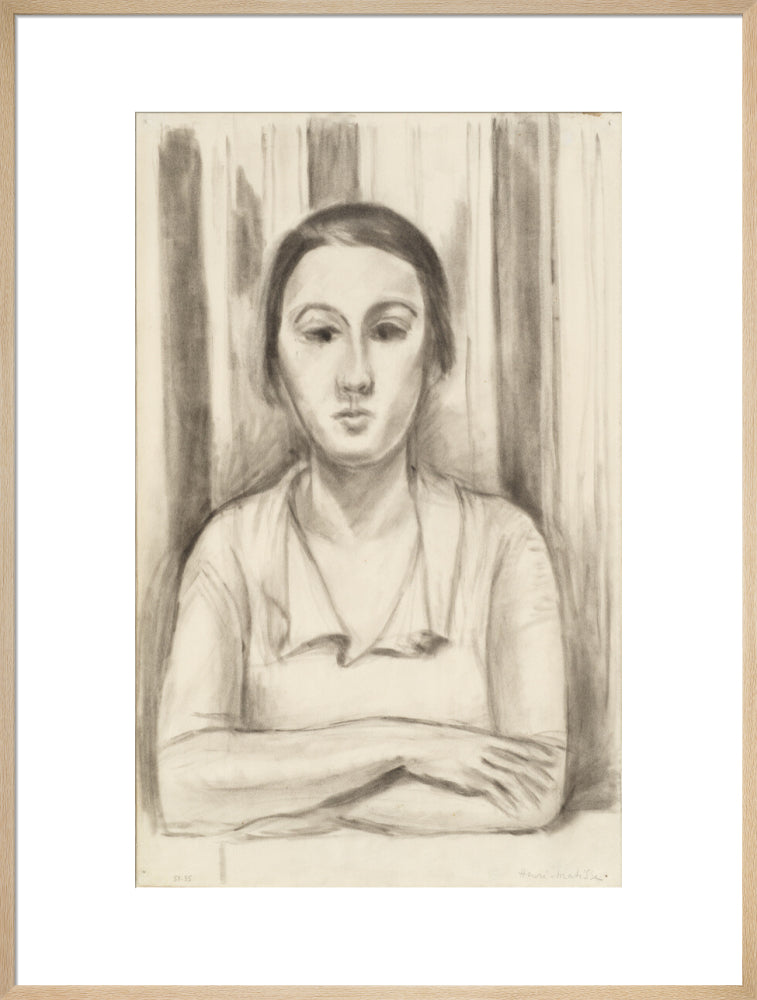 A Woman with her arms on a table
