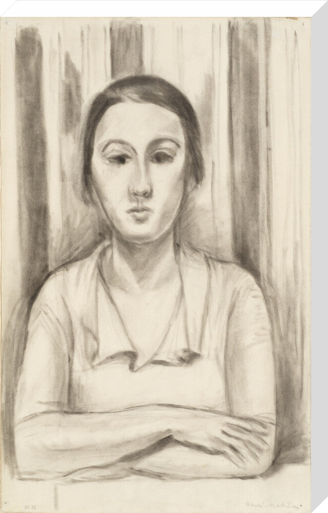 A Woman with her arms on a table