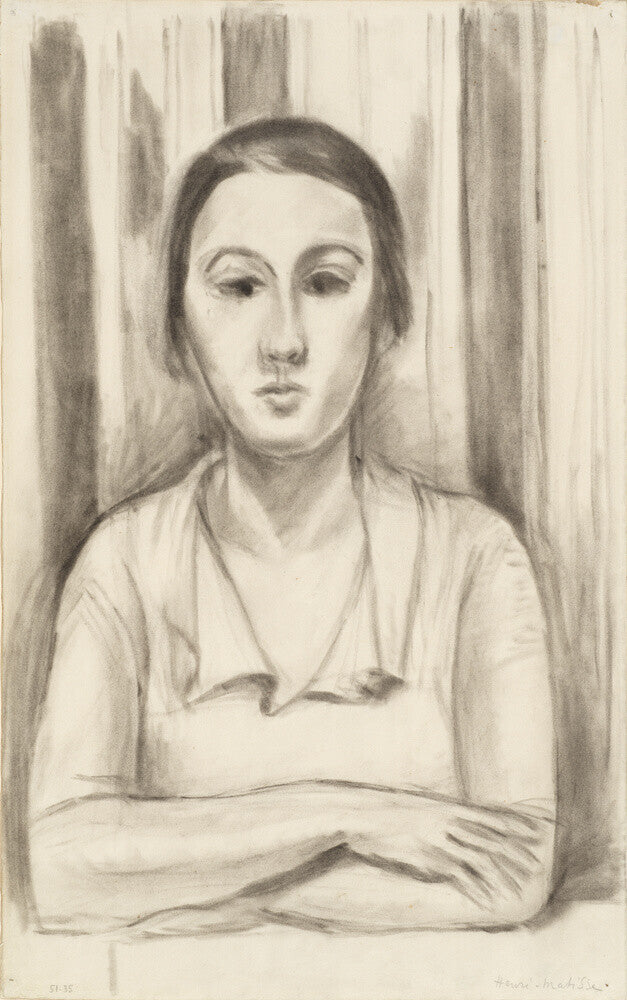 A Woman with her arms on a table
