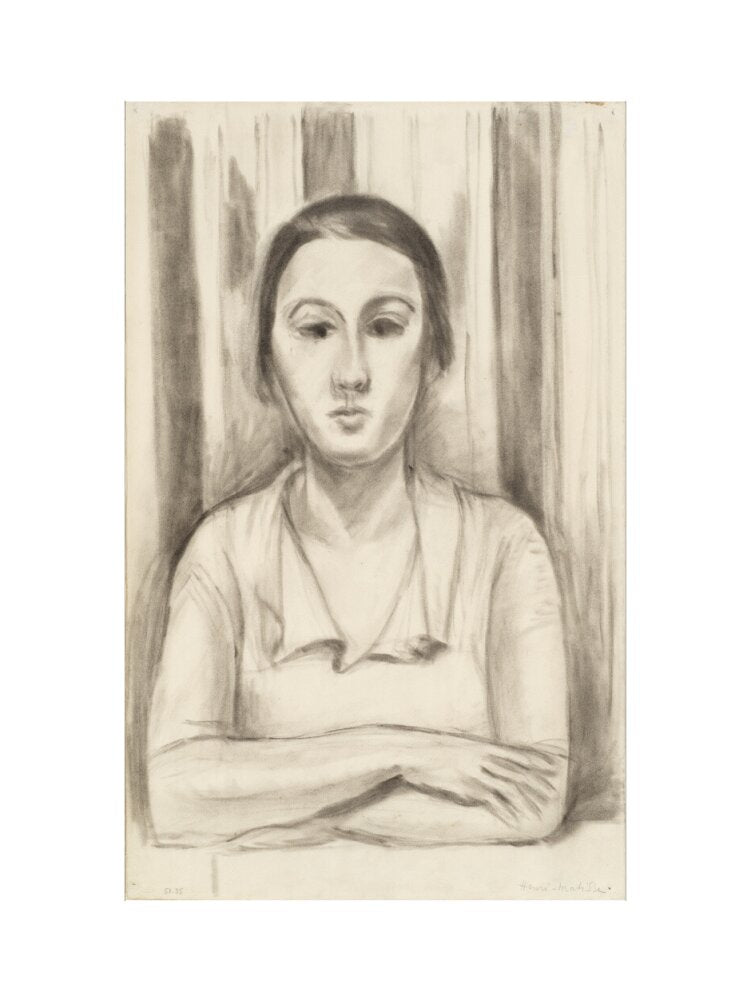 A Woman with her arms on a table