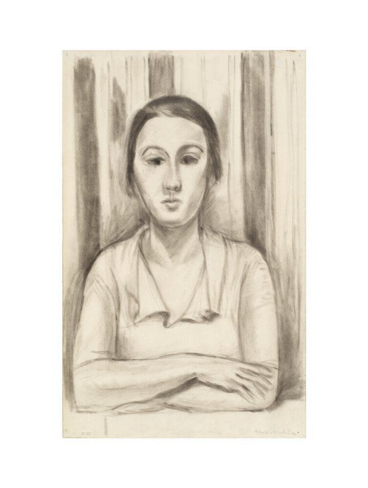 A Woman with her arms on a table