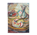 A square textile featuring a colorful still life painting with a vase, bowl, and cup on a tray, shown against a plain white background.
