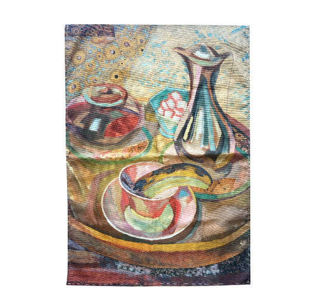 A square textile featuring a colorful still life painting with a vase, bowl, and cup on a tray, shown against a plain white background.